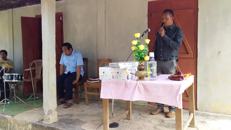 Mr. Wilson Ch. Momin dedicating the offering.
